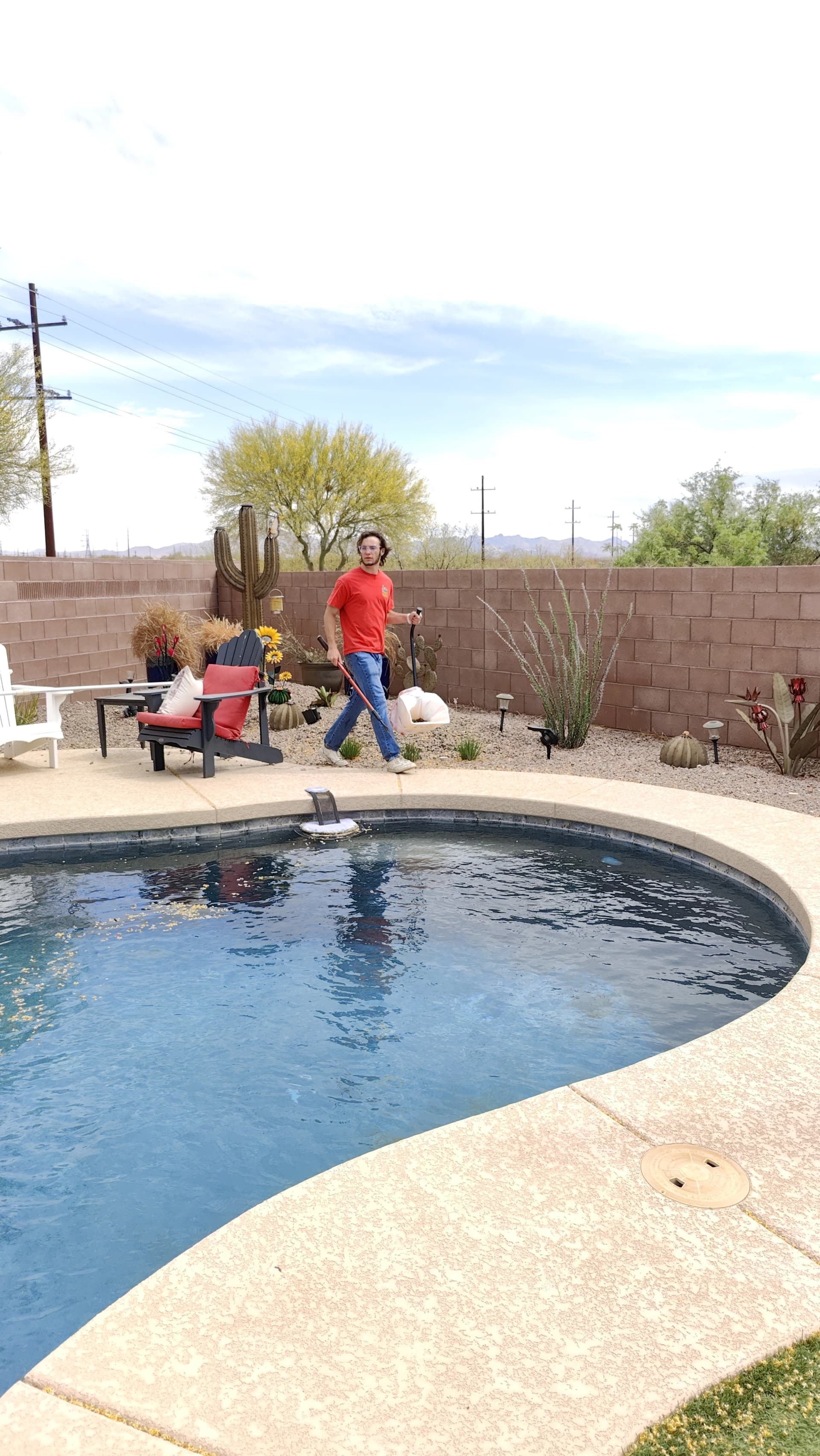 Scoop Doggy Logs team member performing twice-weekly yard cleanup